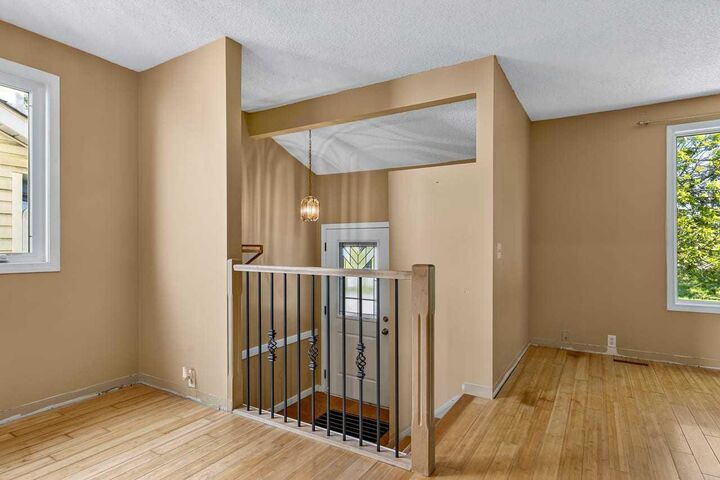 Property Photo:  130 Woodbrook Way SW  AB T2W 4R6 