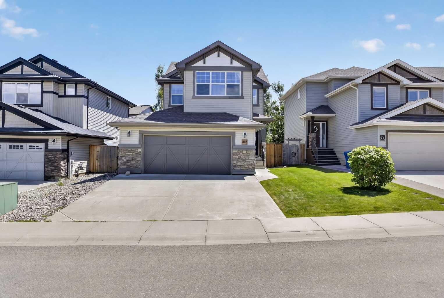 Property Photo:  318 Twinriver Road W  AB T1J 5B9 