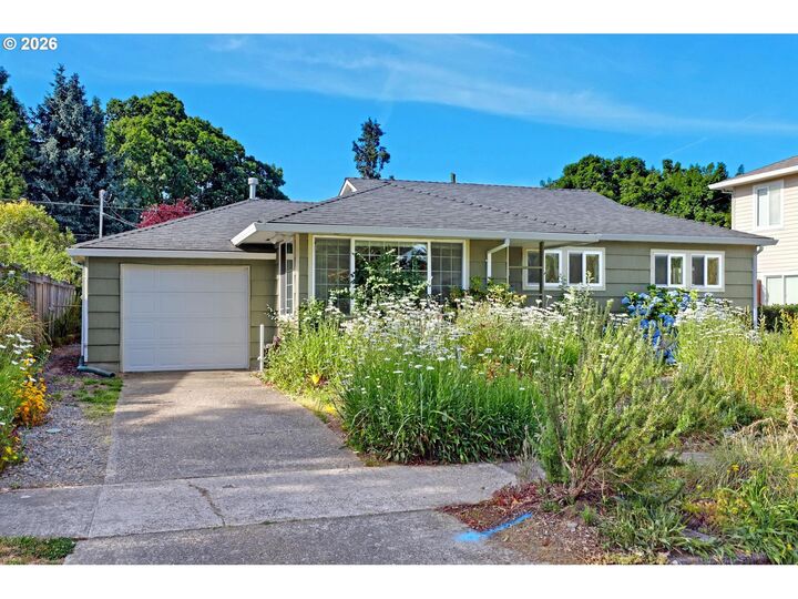 Property Photo:  10910 NE Eugene St  OR 97220 