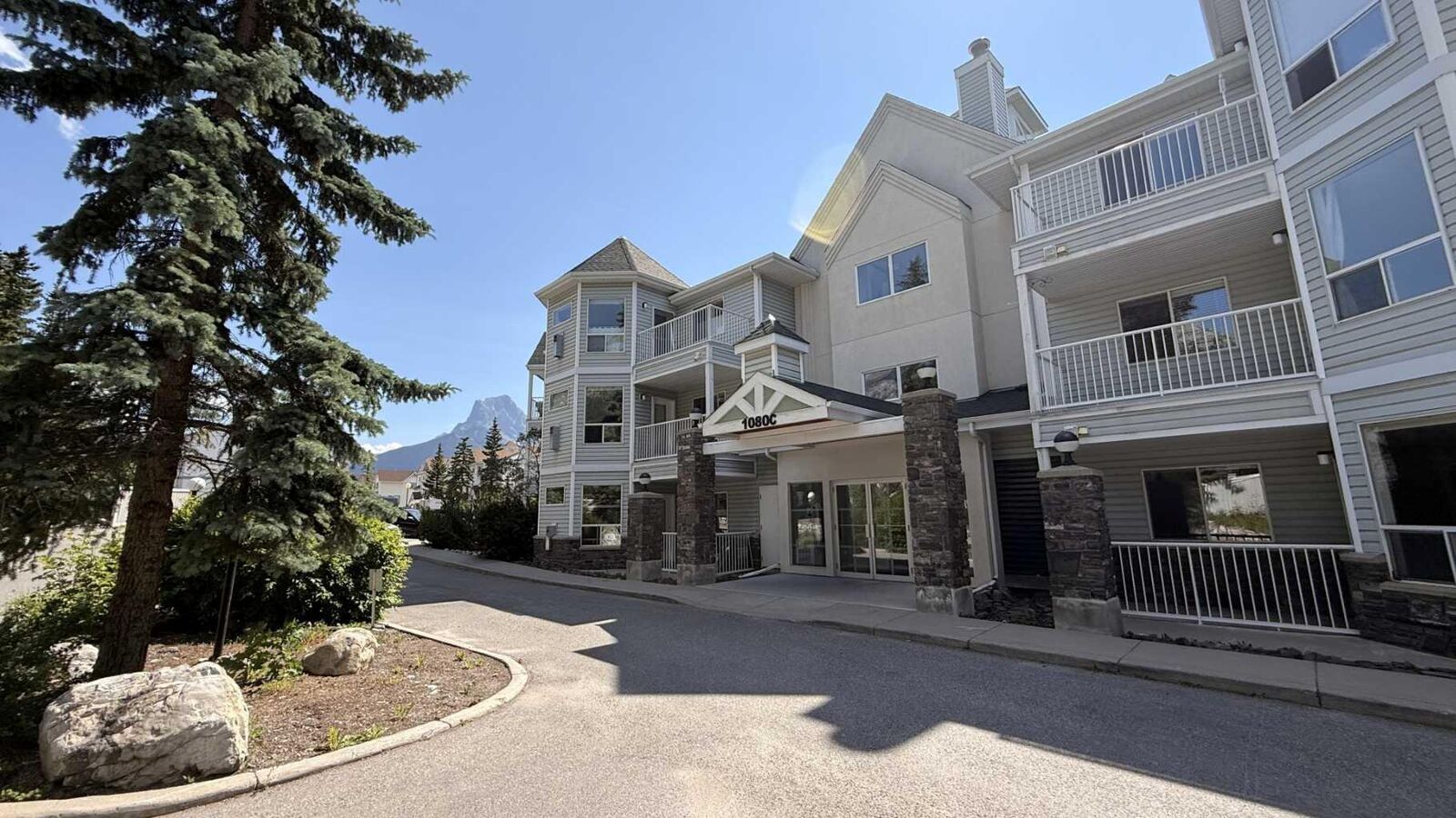 Property Photo: 1080C Cougar Creek Drive 209 AB T1W 2X9