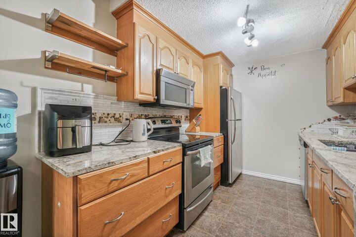 Property Photo:  203B Homestead Crescent NW  AB T5A 2Y2 