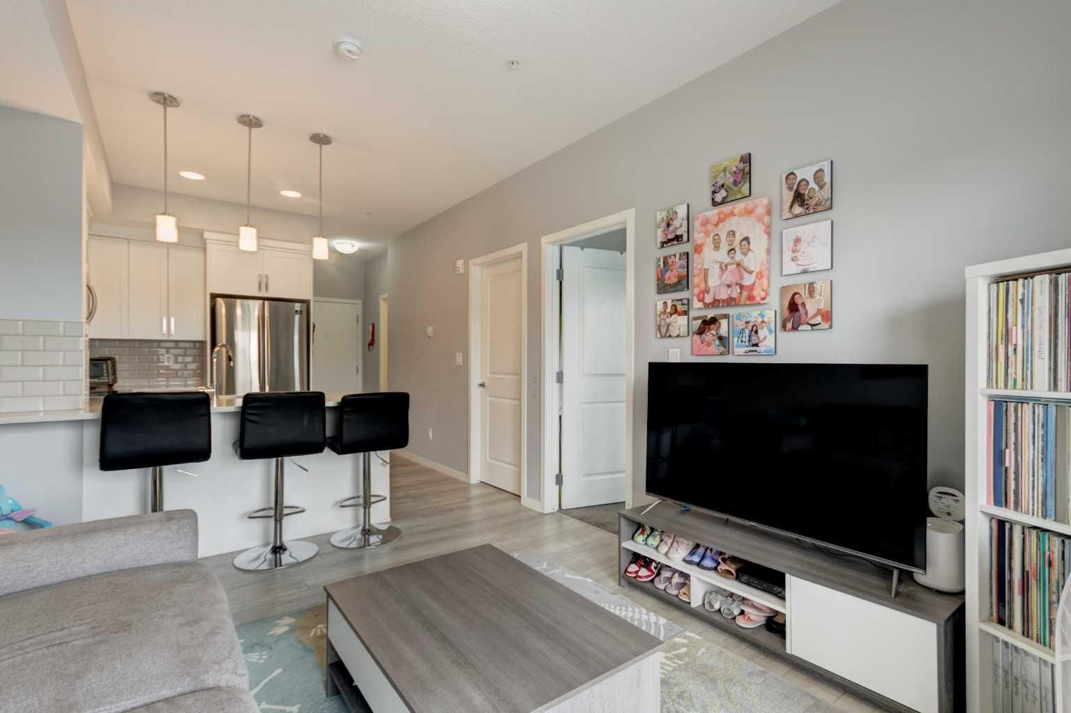 Property Photo: 370 Harvest Hills Common NE 307 AB T3K 2M8