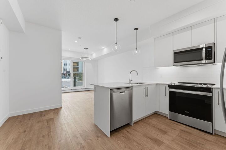 265 Wolf Willow Boulevard SE 2110 — photo 1