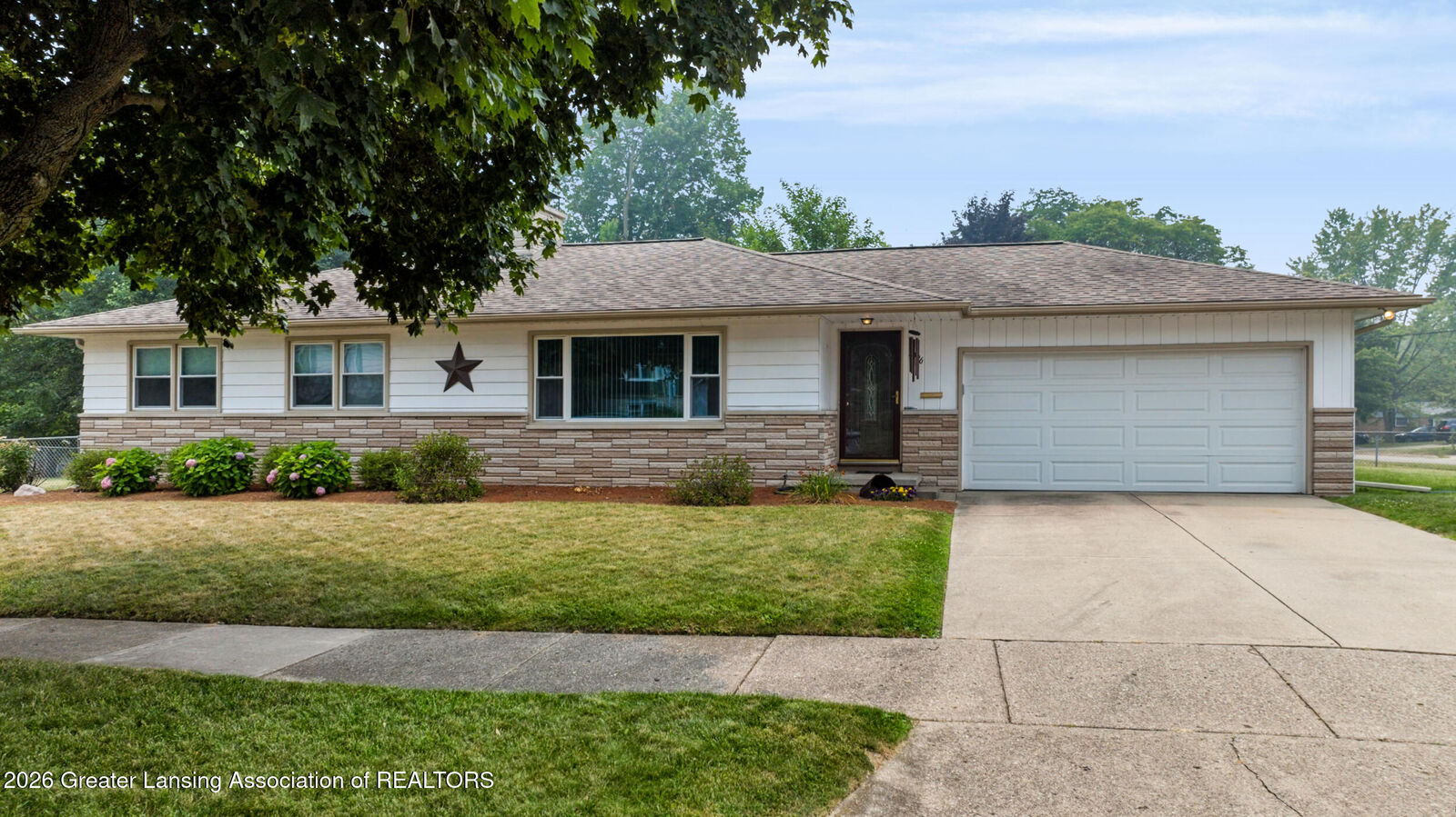 Property Photo:  2406 Lyman Drive  MI 48912 