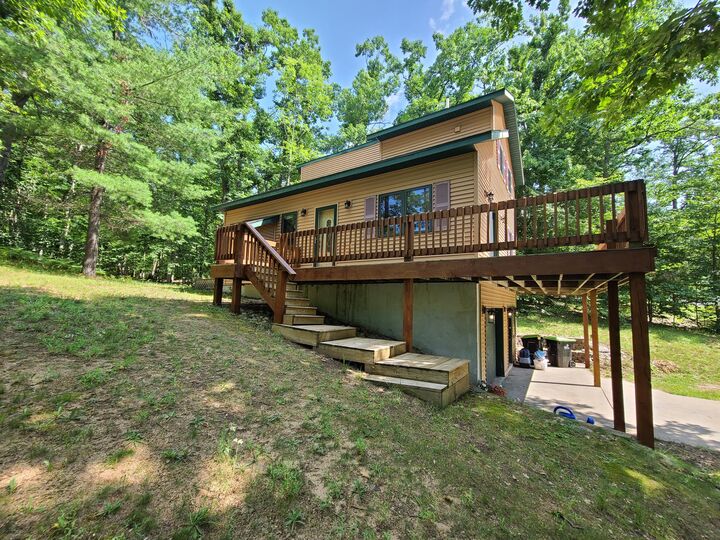 Property Photo:  5861 Arawak Pass  MI 49735 