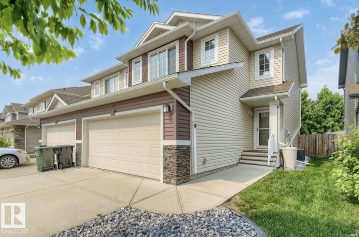 Property Photo:  173 Sunterra Way  AB T8H 0T9 