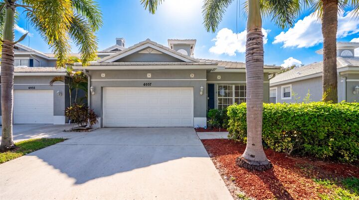 Property Photo:  6957 Blue Skies Drive  FL 33463 