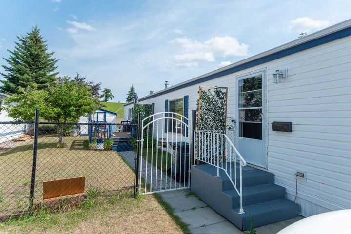 Property Photo: 37543 England Way 337 AB T4S 2C3