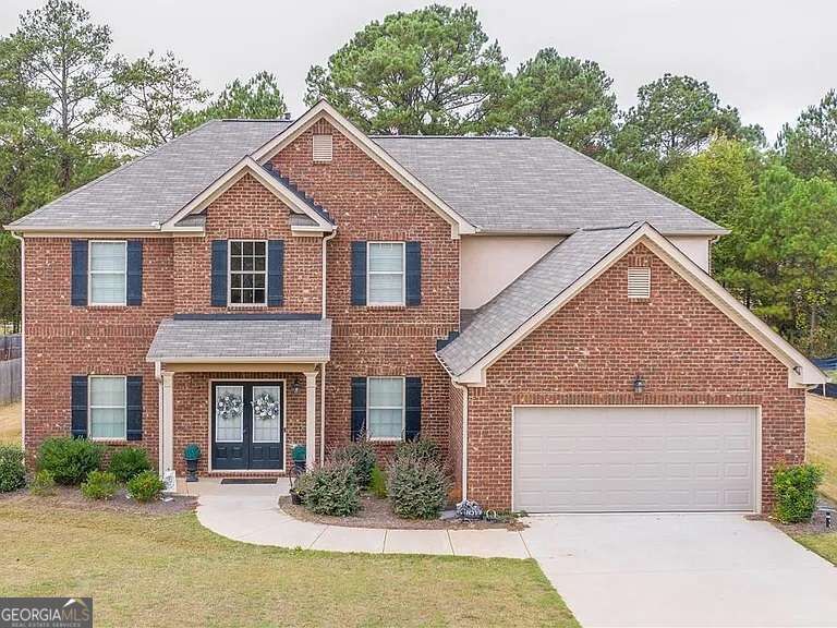 Property Photo:  1132 SE Carillon Drive 34  GA 30013 