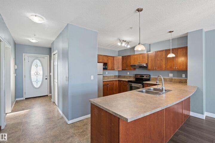 Property Photo: 802 12 Street 209 AB T9M 0A7