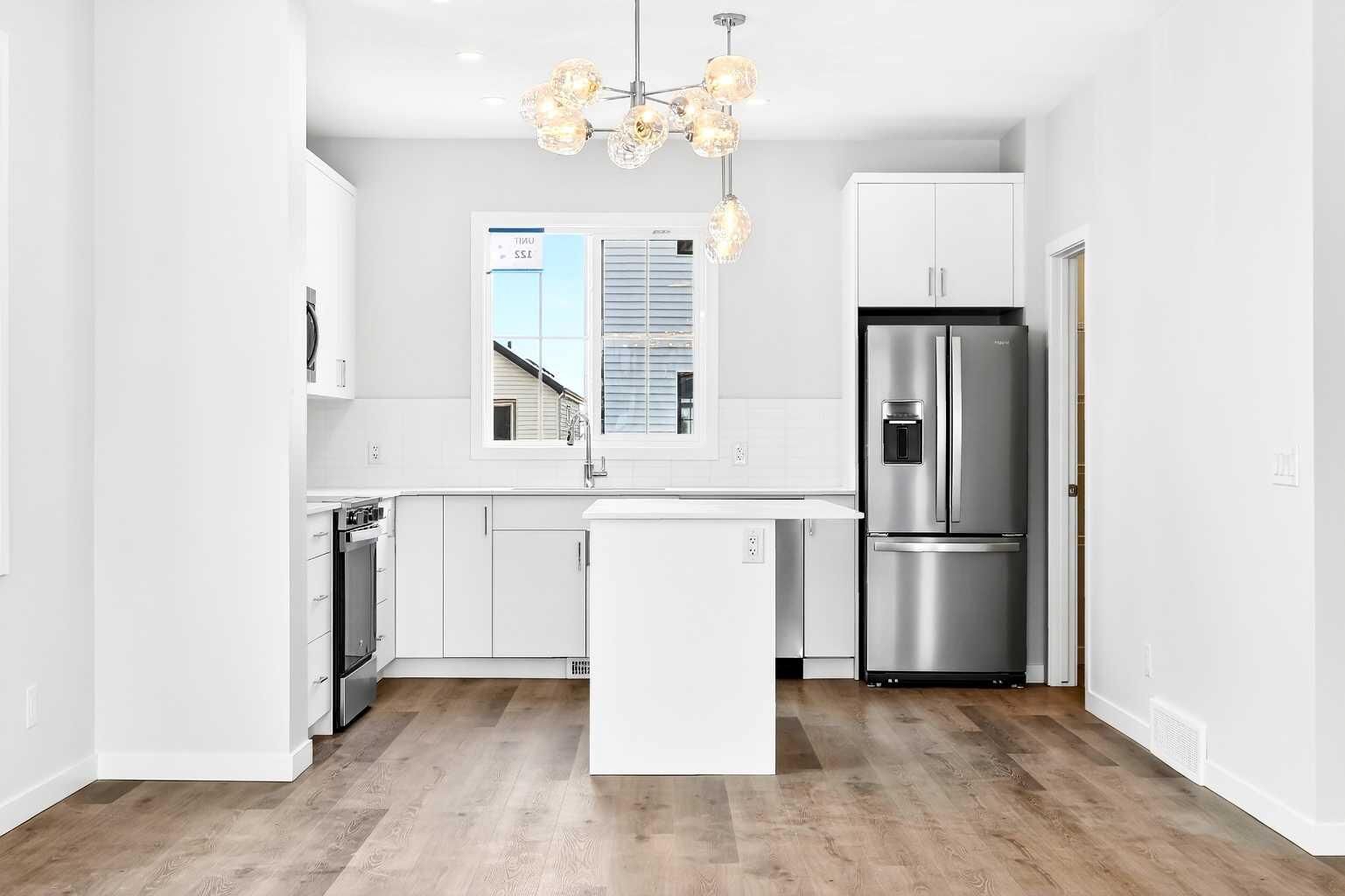 Property Photo: 40 Creekside Way SW 302 AB T2X 6E2