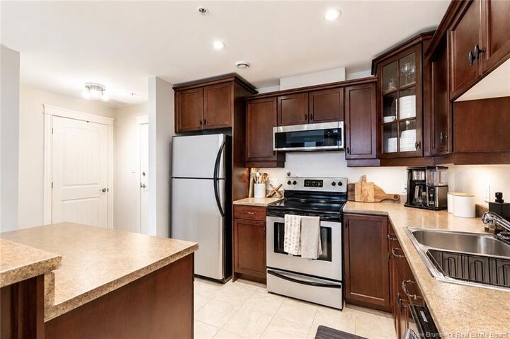 Property Photo: 185 Royal Oaks Boulevard 206 NB E1H 2P7