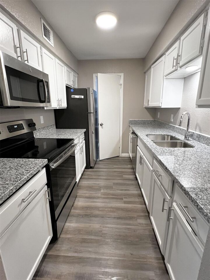 Property Photo:  9700 Leawood Boulevard 7/16  TX 77099 