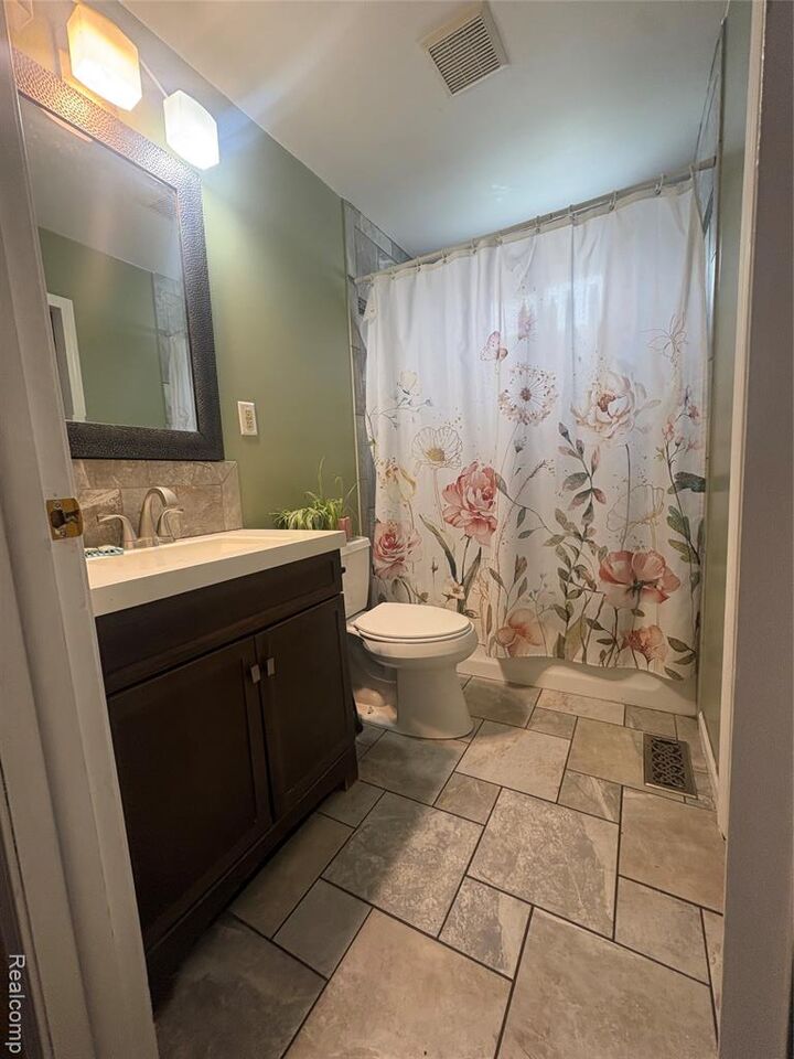 Property Photo:  207 Athletic Street  MI 48463 7710 