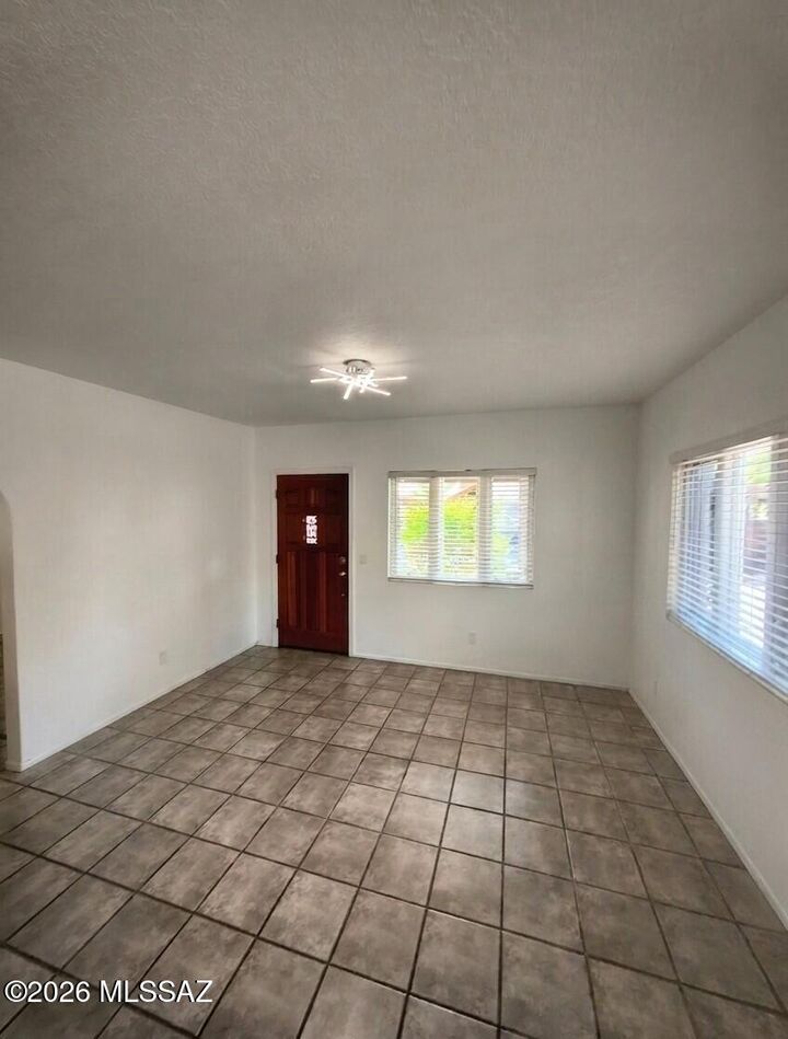 Property Photo:  211 W Roger Road 23  AZ 85705 