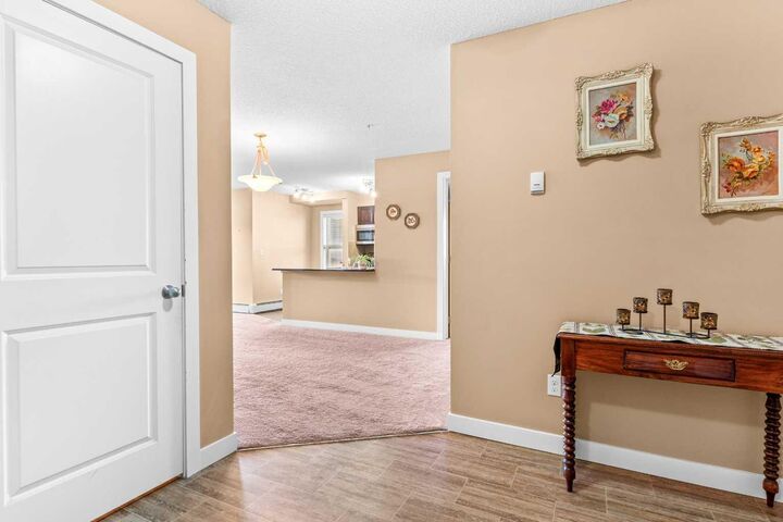 Property Photo:  403 Mackenzie Way SW 7202  AB T4B 3V7 
