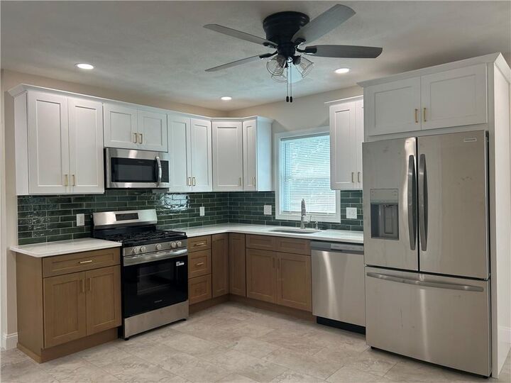 Property Photo:  76 Rosella Avenue  RI 02861 