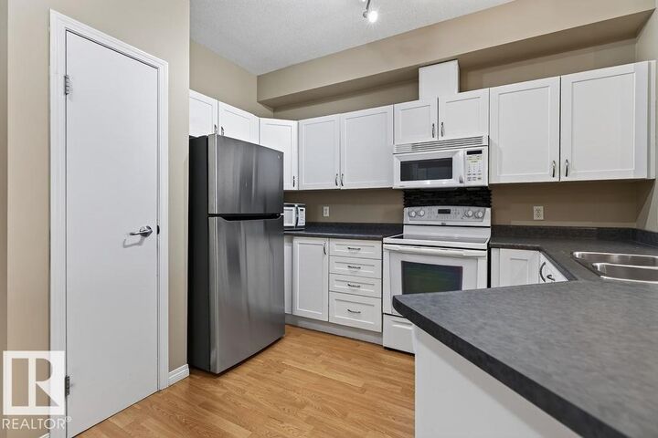 Property Photo:  4304 139 Avenue NW 205  AB T5Y 0H6 