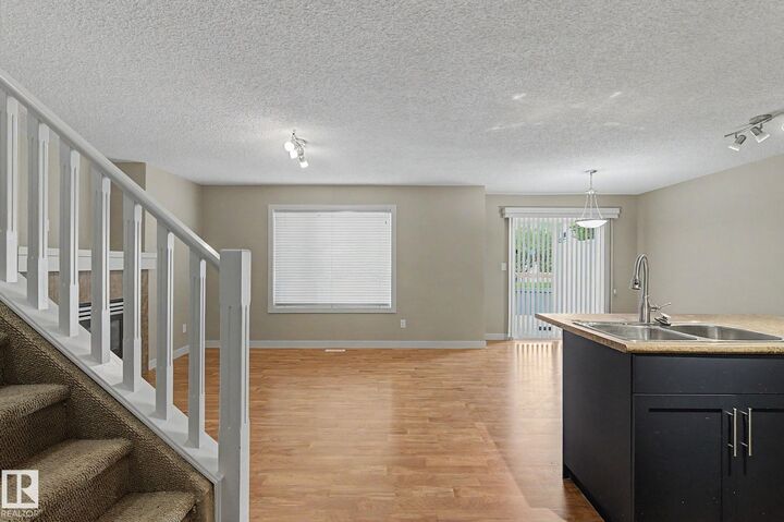 Property Photo:  8602 Southfort Boulevard 11  AB T8L 0J8 