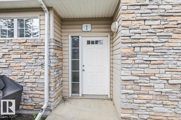 Property Photo: 1179 Summerside Drive SW 1 AB T6X 1K1