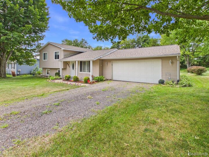 Property Photo: 4411 Huckleberry Circle MI 48421 9703