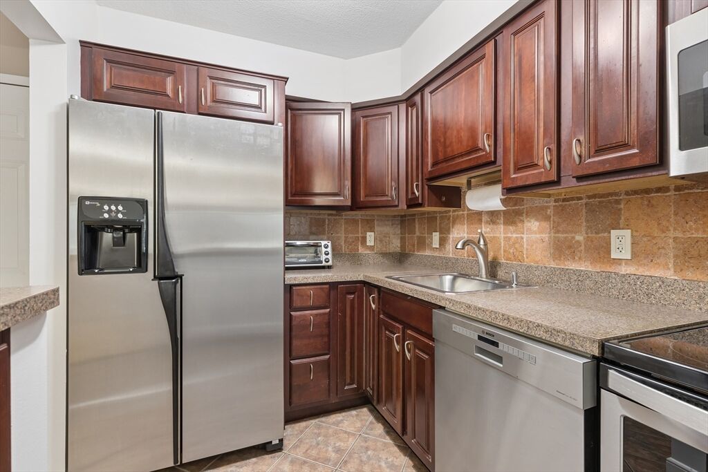 Property Photo:  4975 Washington St 209  MA 02132 