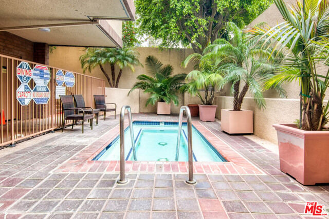 Property Photo:  235 S Tower Dr, Unit 102  CA 90211 