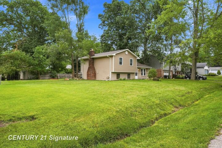 Property Photo:  711 Harry Paul Drive  MI 48362 