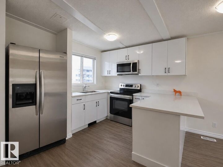 Property Photo:  14458 56 Street NW  AB T5A 3R1 
