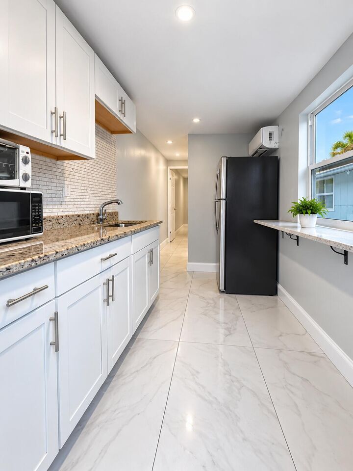 Property Photo:  115 Walker Avenue  FL 33463 