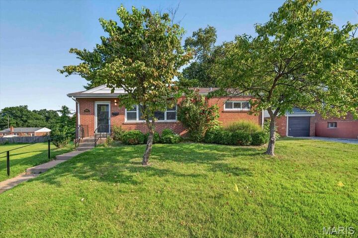 Property Photo:  8561 Everett Avenue  MO 63117 