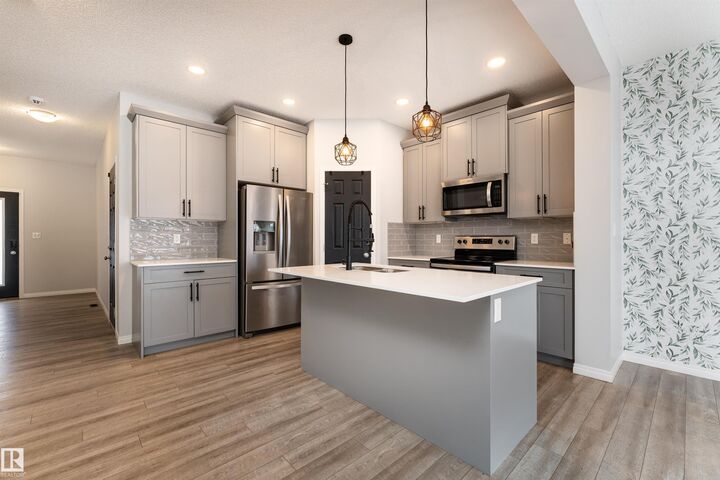 Property Photo:  6484 King Wynd SW  AB T6W 3Z9 