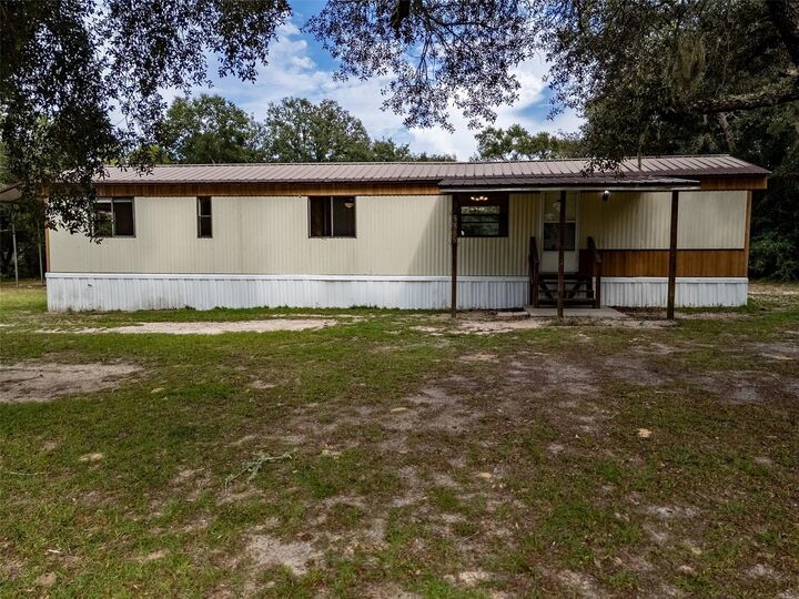 Property Photo:  5865 NE 137th Terrace  FL 32696 