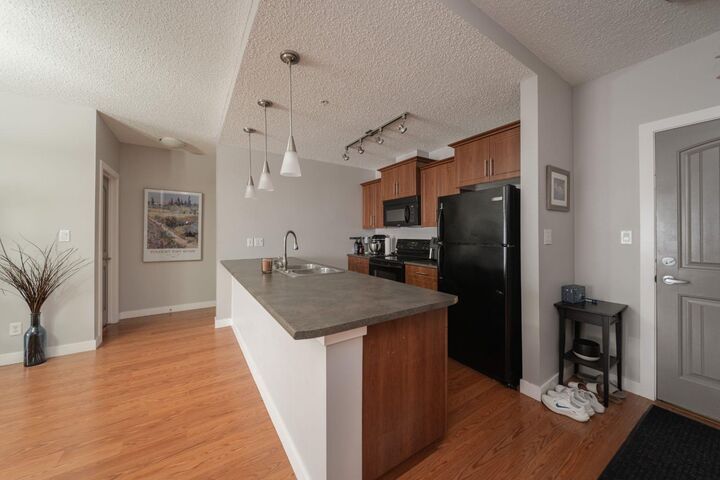 Property Photo:  204 Sparrow Hawk Drive 2101  AB T9K 0L3 