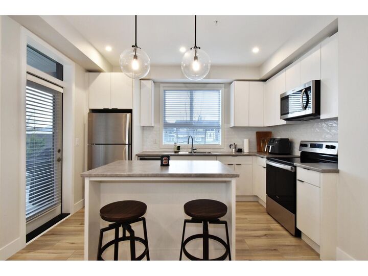 Property Photo:  1514 McCallum Road 112  BC V2S 0L8 