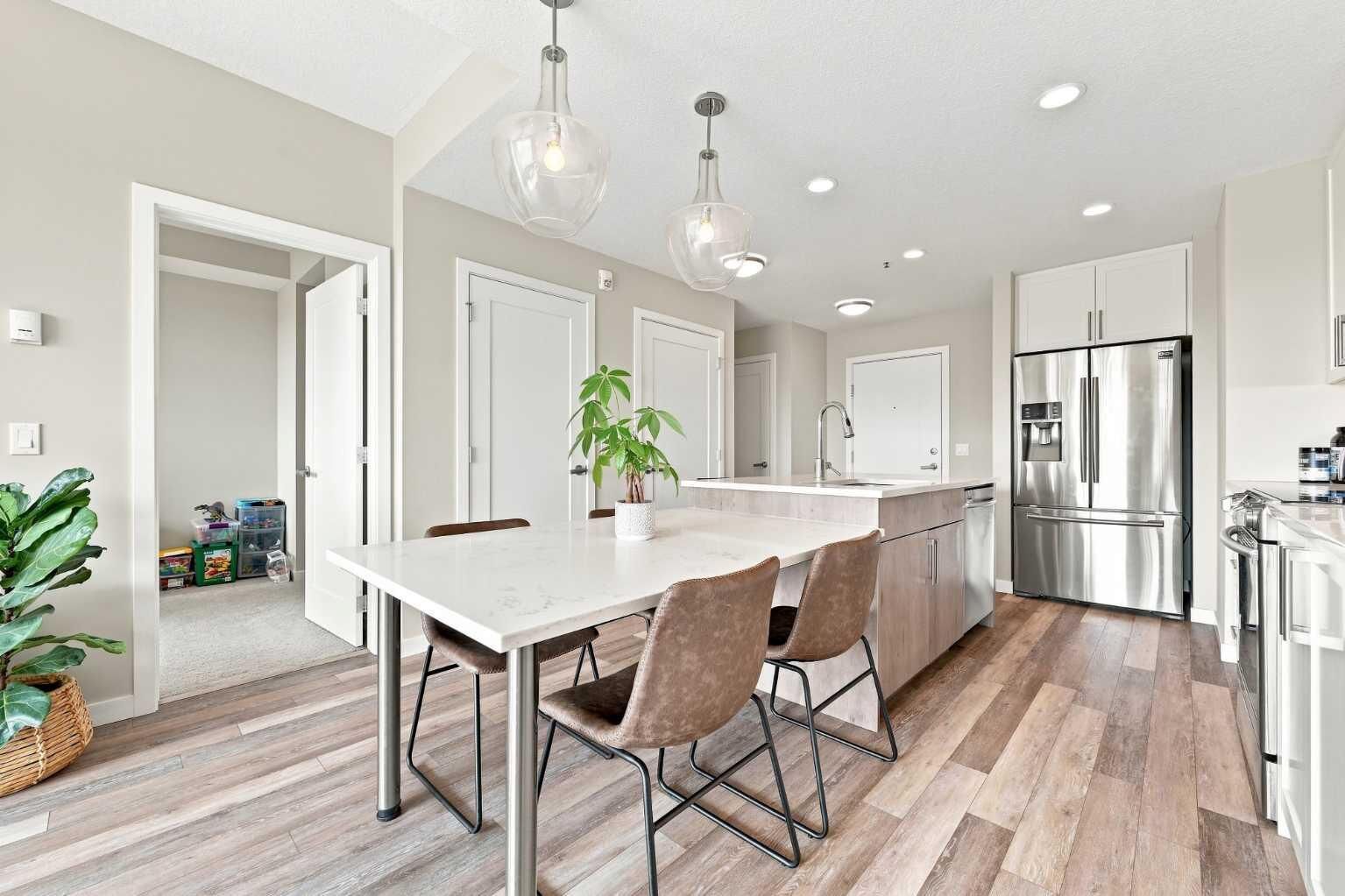 Property Photo:  8530 8A Avenue SW 320  AB T3H 6A7 