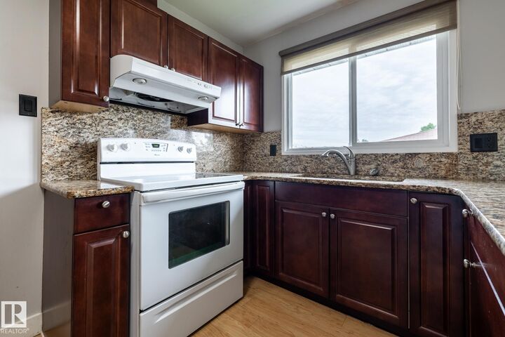 Property Photo:  8836 150 Avenue NW  AB T5E 2N5 