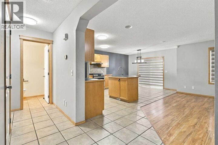Property Photo:  209 Tuscany Ravine Road Northwest  AB T3L 2W9 