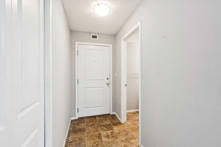 Property Photo:  403 Mackenzie Way SW 3108  AB T4B 3V7 