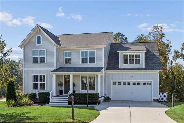 Front of 7460 Winding Jasmine Road on its corner lot