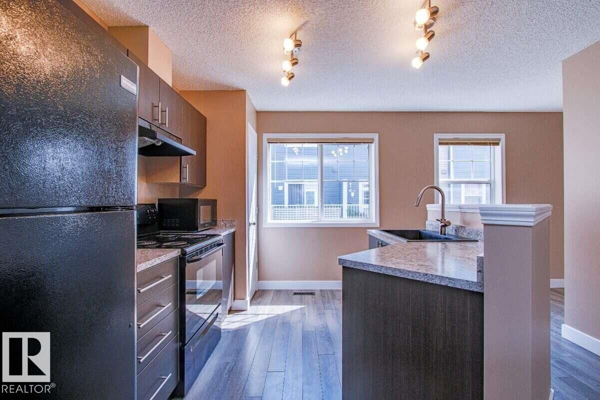 Property Photo:  8304 11 Avenue SW 15  AB T6X 1J8 