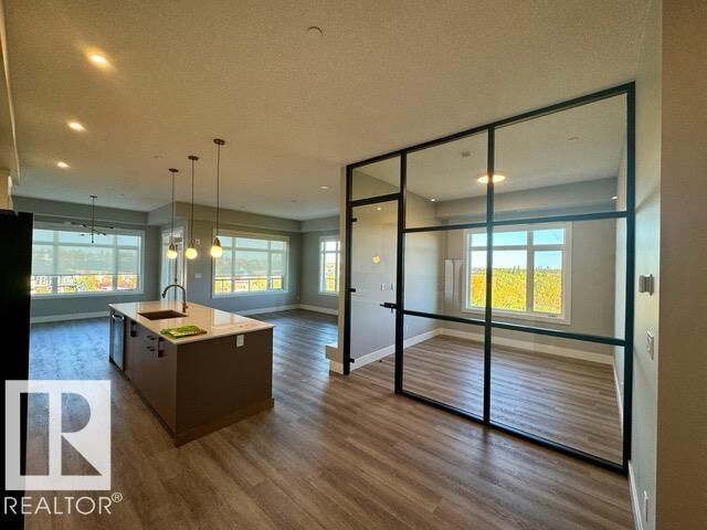 Property Photo: 7471 May Common NW 410 AB T6R 0X5