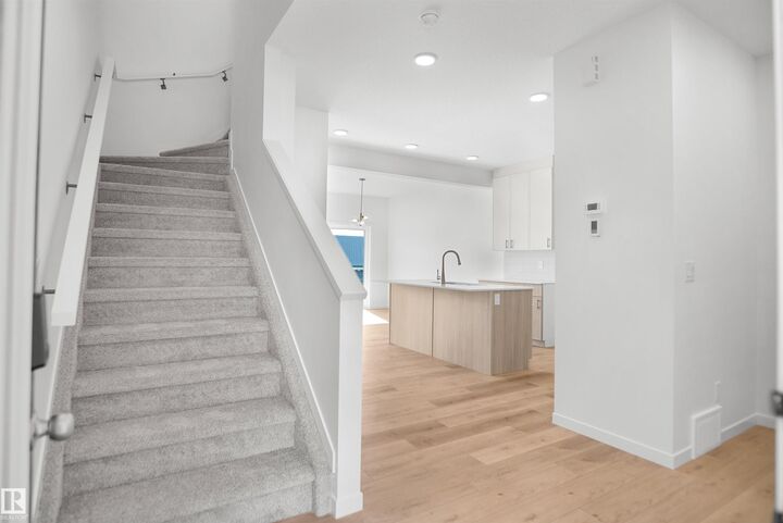 Property Photo:  20917 24 Avenue NW  AB T6T 2N8 