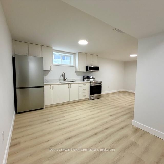 Property Photo:  293 Glebemount Avenue Lower  ON M4C 3V4 