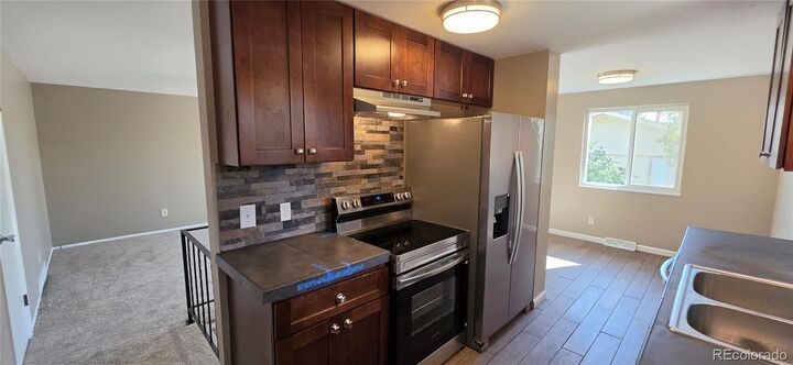 Property Photo:  6335 Dudley Street 6339  CO 80004 