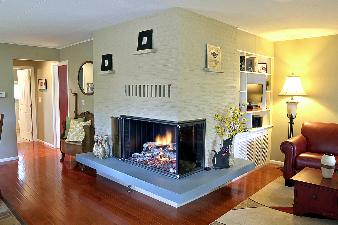 Property Photo: Living room with gas fireplace 2916 Walnut Ave SW  WA 98116 