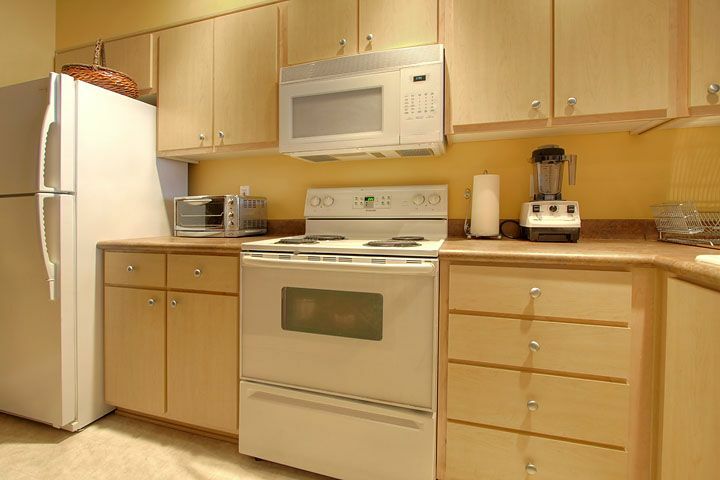 Property Photo: Living area & kitchen 13301 SE 79th Place B307  WA 98059 